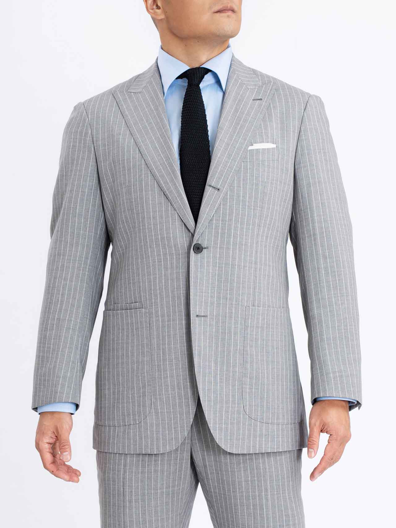 A man is wearing a Grey Pinstripes Blazer.