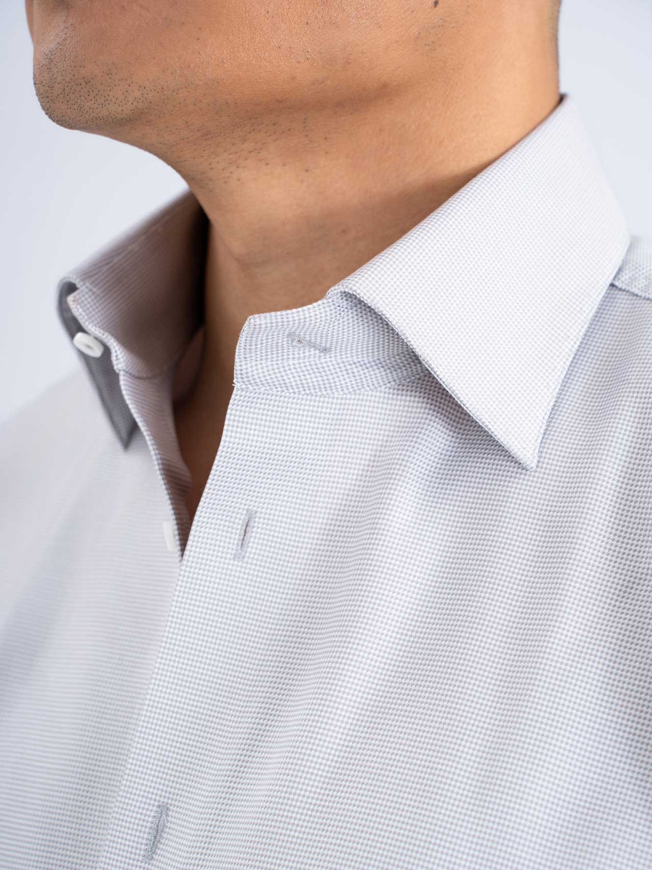 A close up of a man's neck featuring a Grey shirt, cut away collar, Cotton 100s.