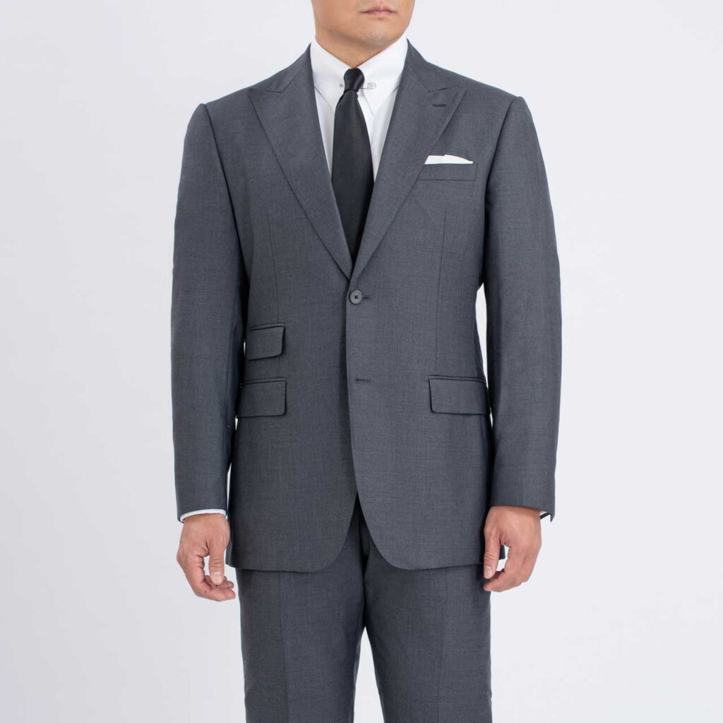 A man wearing a Grey Blazer, Australian Wool, Super 150's made from Super 150's fabric.