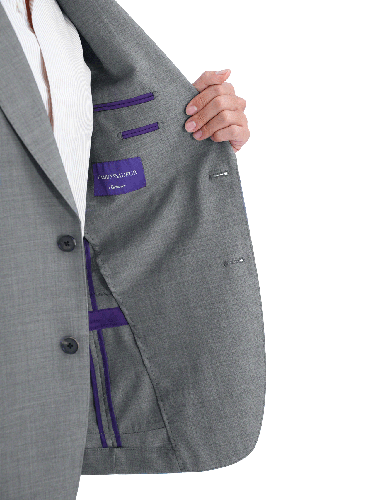 Person showcasing the interior lining of a Traveler, Grey suit jacket, highlighting the label.