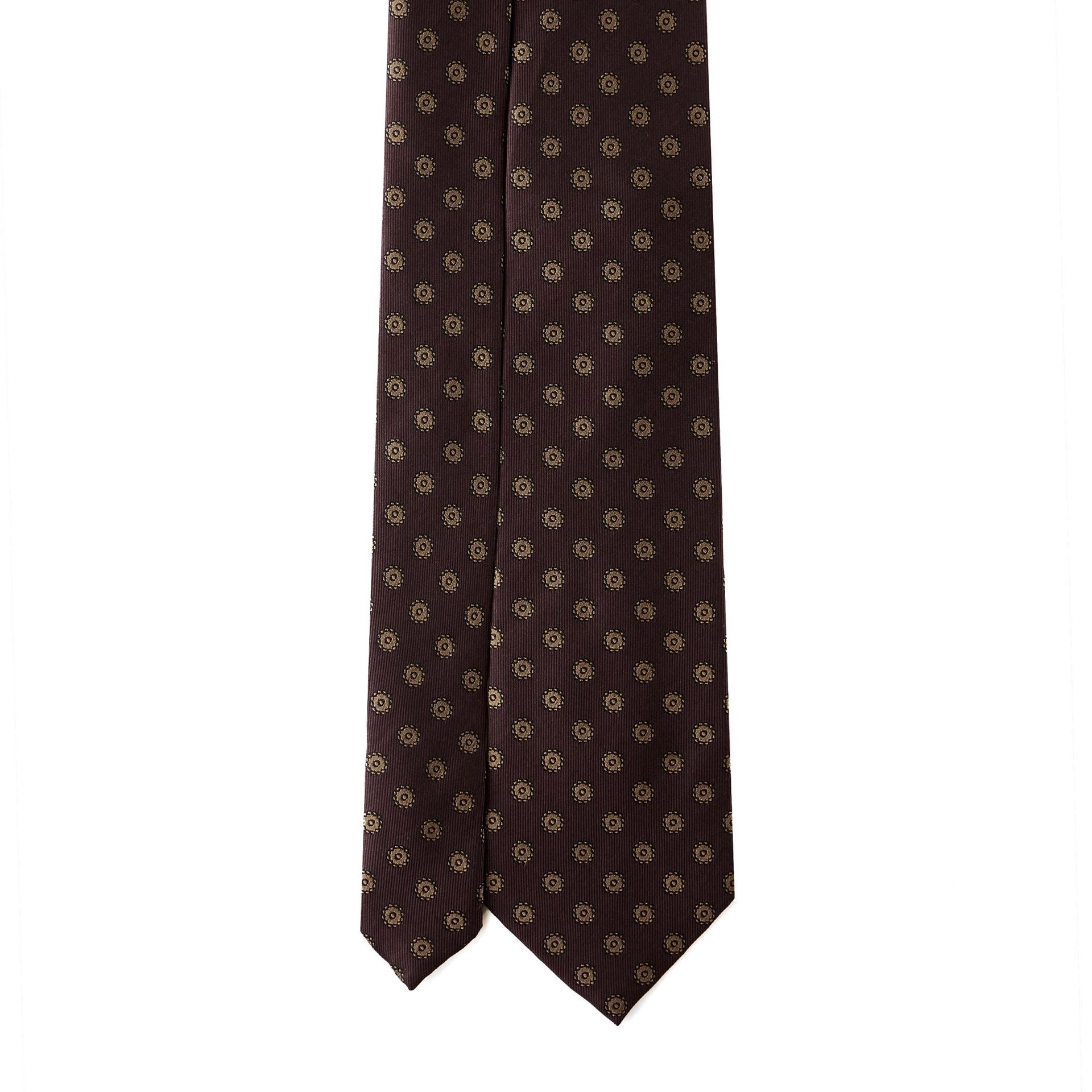 A brown tie with a floral pattern isolated on a white background.