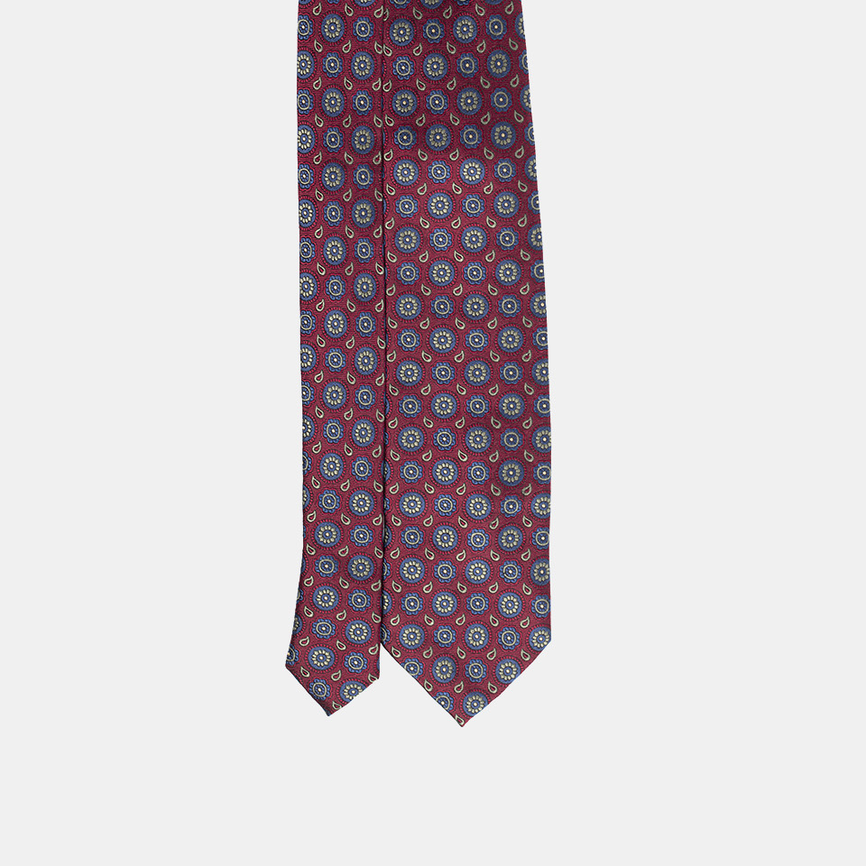 A patterned necktie isolated on a white background.