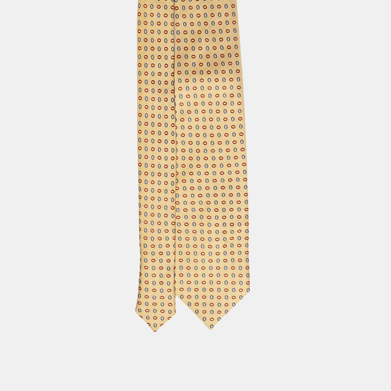 Patterned necktie on a plain background.