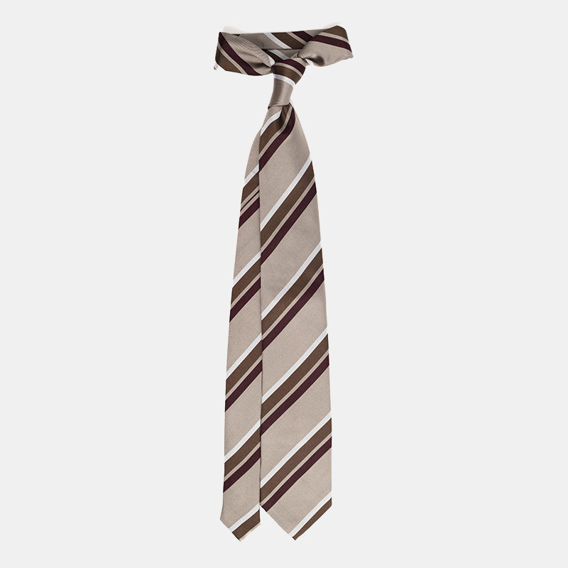 Striped necktie in shades of brown and white.