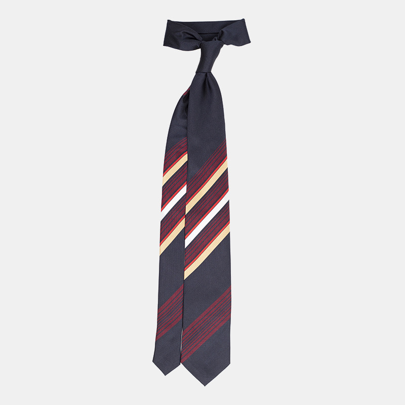 Striped necktie with a dark background and diagonal red, beige, and blue stripes, isolated on a white background.