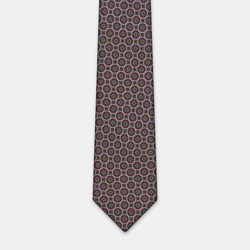 Silk tie, n°139 with intricate design on a plain white background.