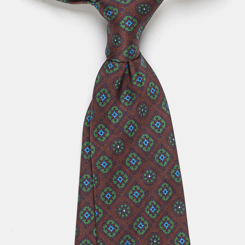 A patterned silk tie, with a Windsor knot