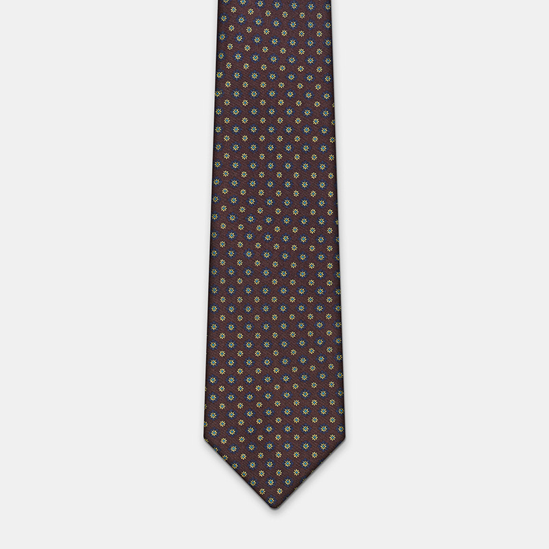 Silk tie, n°137 with a dark background and multicolored detail, perfect for pairing with a white ceremony shirt.