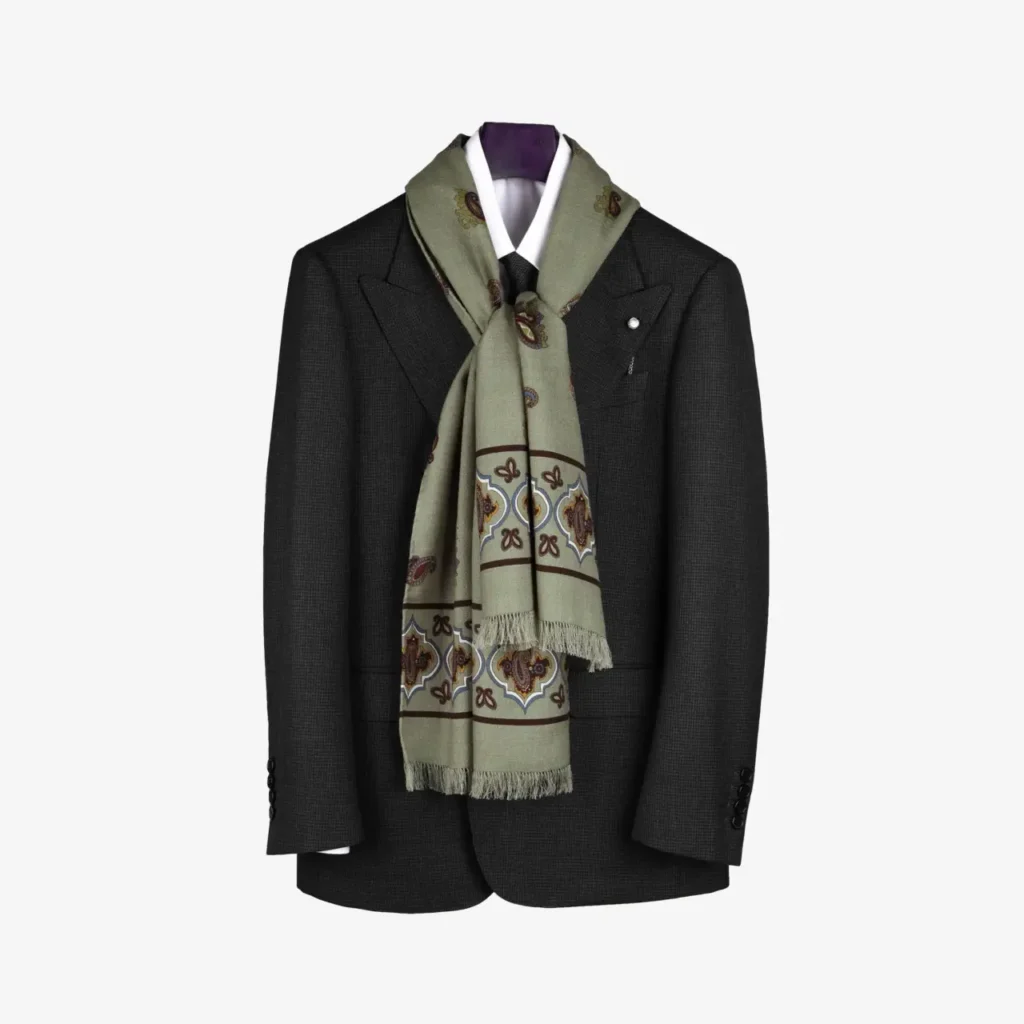 A dark suit jacket on a hanger, elegantly styled with the Fidema wool and silk scarf in deep plum, featuring a subtle pattern, draped around the collar and tied neatly in front.