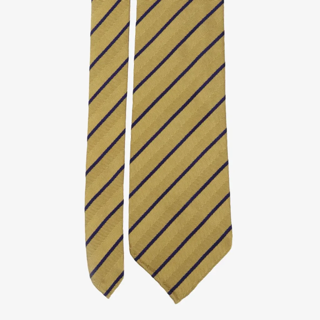 Olive green silk tie featuring abstract medallion patterns. The Abstract medallions silk tie – Olive green (Copy) has a pointed tip and is displayed on a white background.