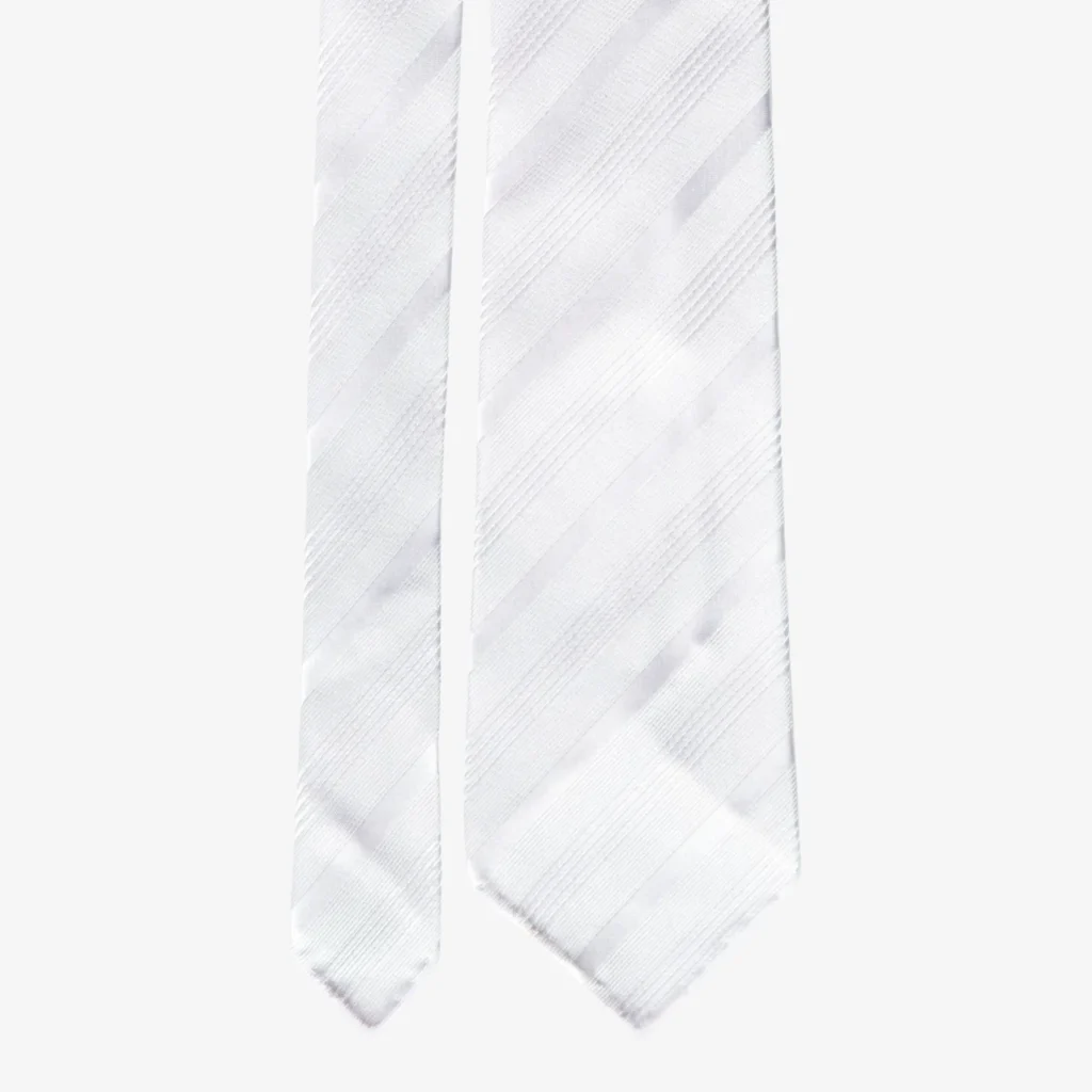 A close-up of the Wide stripes silk tie – Blue and brown, featuring bold diagonal stripes, shown against a plain light background.