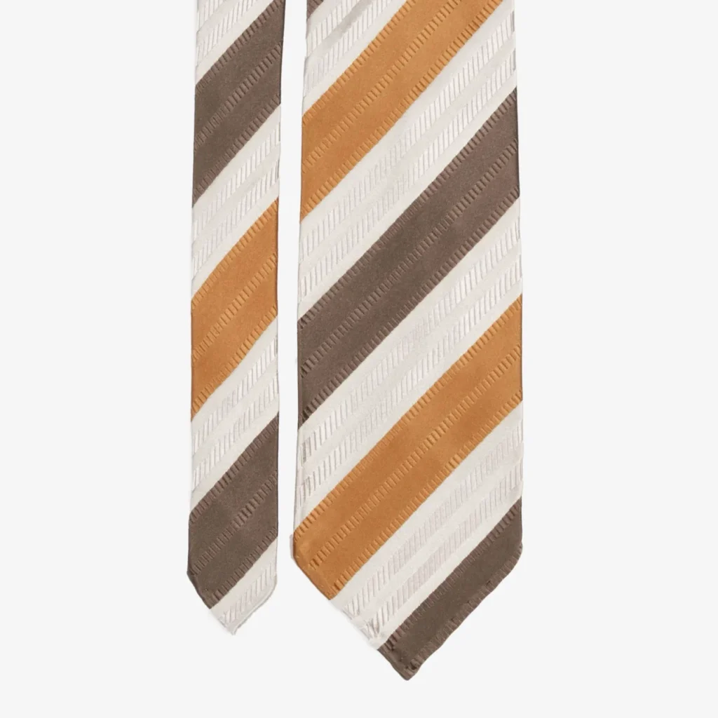 A stylish silk tie featuring wide blue and brown stripes on a crisp white background.