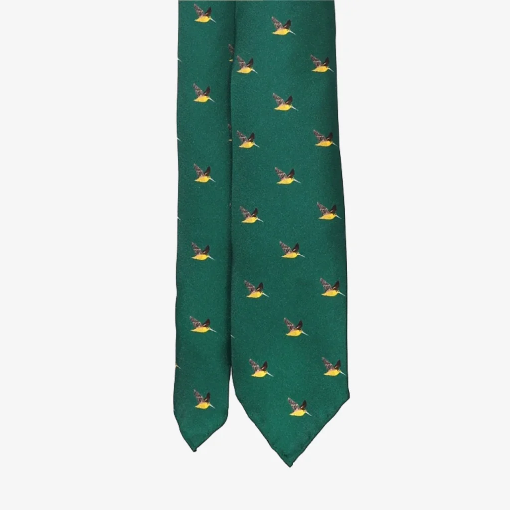 A blue silk tie featuring a geometric floral pattern, offering a stylish twist on the classic necktie look.